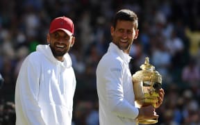 Nick Kyrgios and Novak Djokovic after the 2022 Wimbledon final.