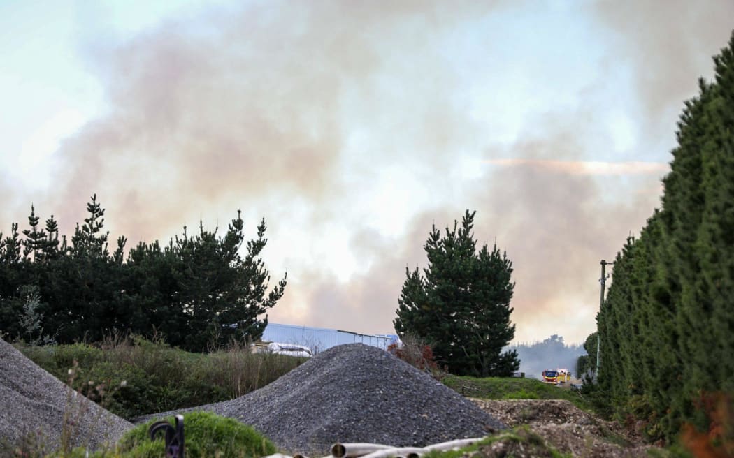 Fire crews south of Ashburton battled a large rural blaze burning through around 14,000 hay bales on Thursday.