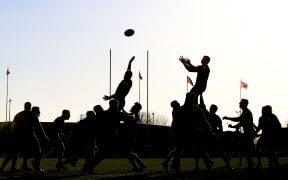 Rugby lineout in silhouette