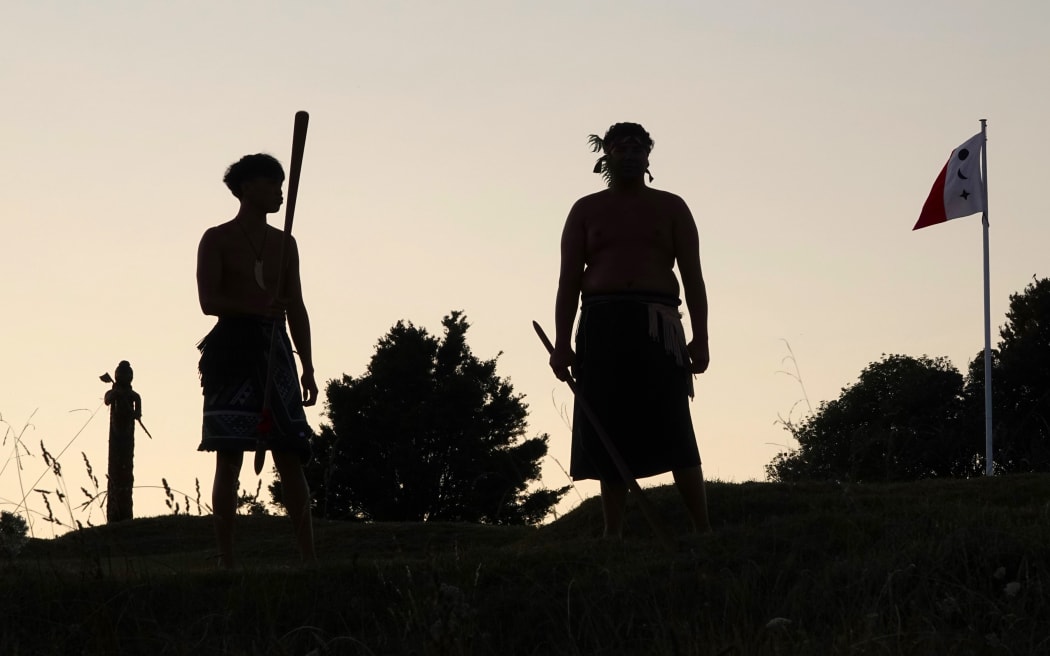 Sentries silhouetted by the dawn sky at Ruapekapeka Pā.