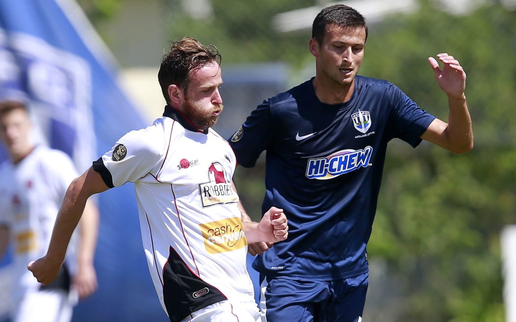 Canterbury's Gary Ogilvie up against Auckland's Mario Bilen.