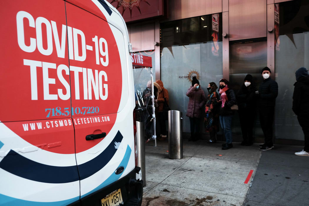 : People wait in long lines in Times Square to get tested for Covid-19 on December 20, 2021 in New York City.