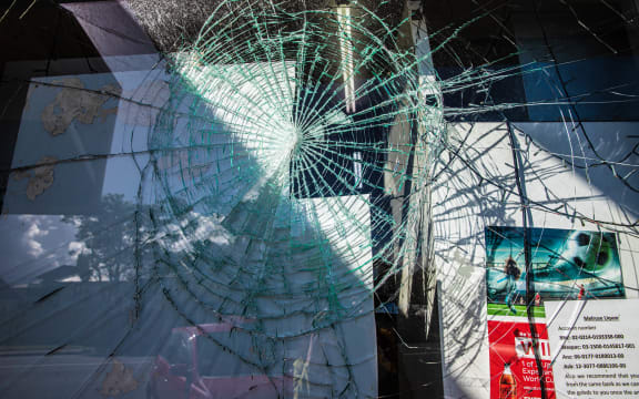 A broken window at Melrose Liquor in Mt Roskill.