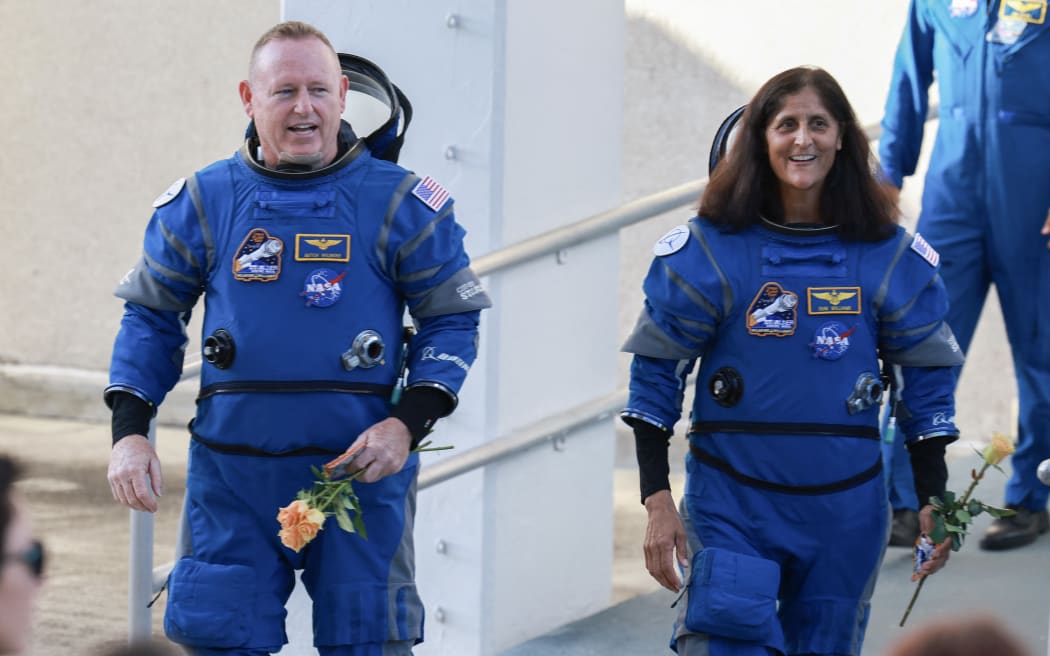 CAPE CANAVERAL, FLORIDA - JUNE 05: NASA’s Boeing Crew Flight Test Commander Butch Wilmore (L) and Pilot Suni Williams walk out of the Operations and Checkout Building on June 05, 2024 in Cape Canaveral, Florida. The astronauts are heading to Boeing’s Starliner spacecraft, which sits atop a United Launch Alliance Atlas V rocket at Space Launch Complex 41 for NASA’s Boeing crew flight test to the International Space Station.   Joe Raedle/Getty Images/AFP (Photo by JOE RAEDLE / GETTY IMAGES NORTH AMERICA / Getty Images via AFP)