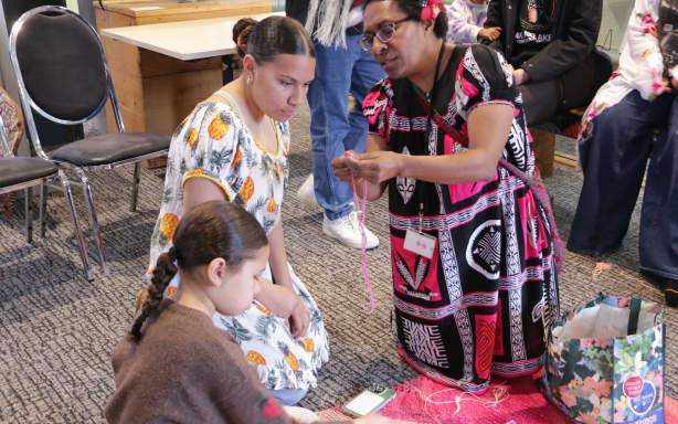 Bilum weaving workshop at Pataka, one of a series of events in Tok Pisin Wik, marking PNG's language and cultures.