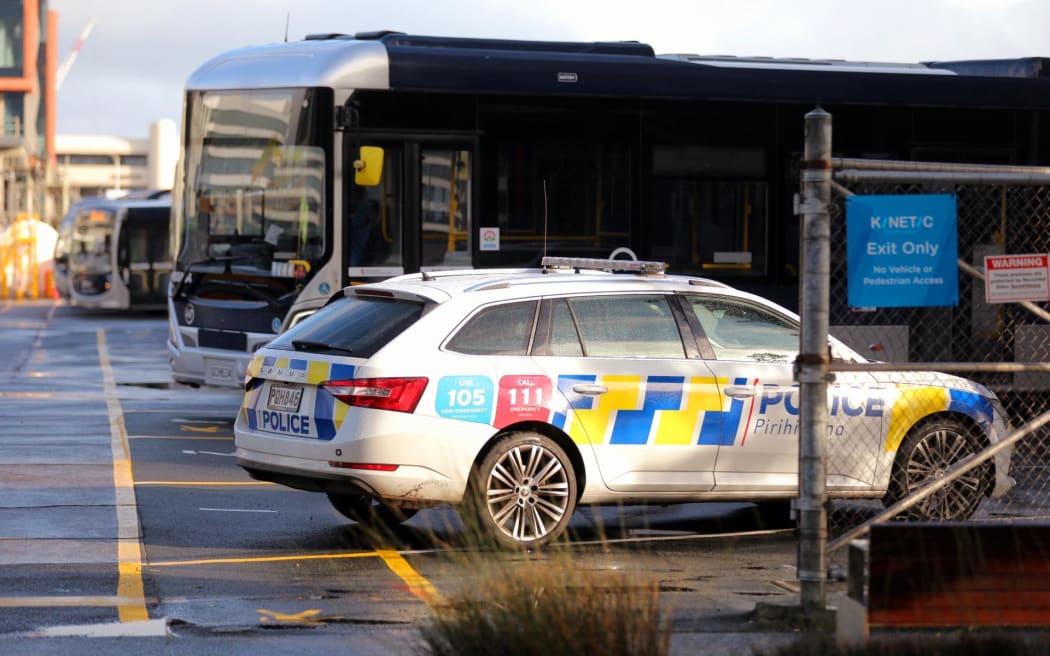 Police at the bus depot on Halsey St after a body was found.