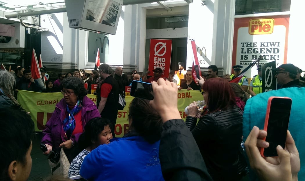 Protesters block the entrance of McDonald's on Queen Street