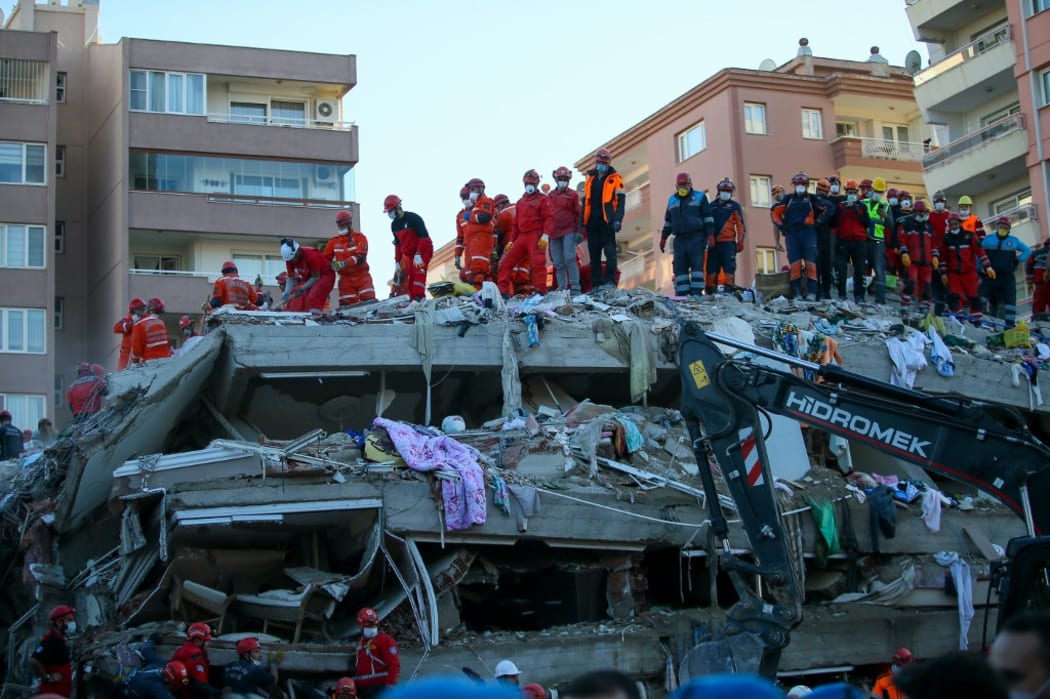 IZMIR, TURKEY - OCTOBER 31: Search and rescue works continue at debris of a building following a magnitude 6.6 quake shook Turkey's Aegean Sea coast, in Izmir, Turkey on October 31, 2020.