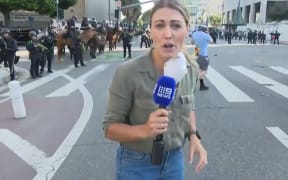 Australian journalist Lauren Tomasi was shot in the leg with a rubber bullet while reporting on protests against US immigration enforcement in Los Angeles this week.