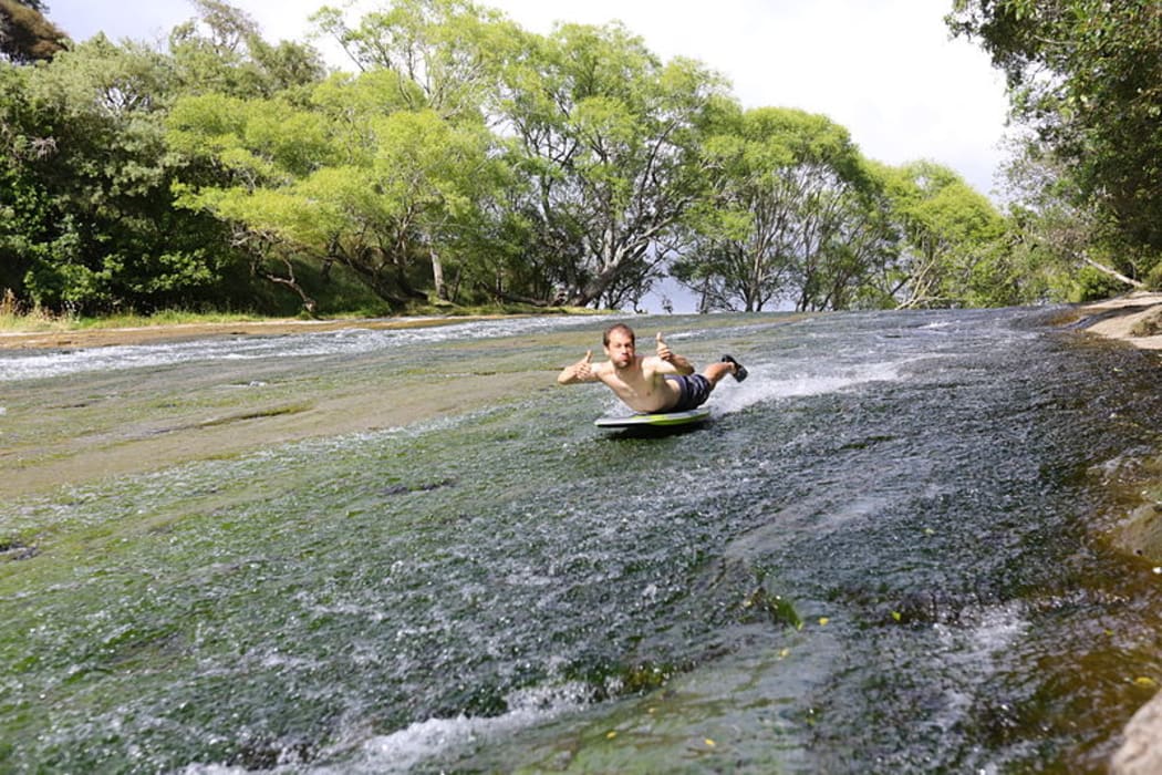 A photo posted in January 2014 shows a swimmer sliding down the Rere Rockslide, in Gisborme.