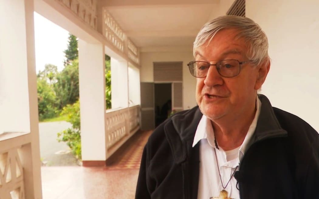 Nouméa archbishop Monsignor Michel-Marie Calvet on the scene of destroyed Saint Louis Mission – Photo NC la 1ère