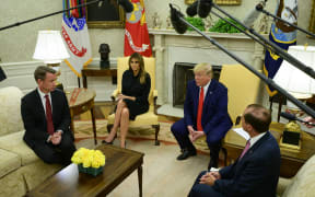Donald Trump flanked by acting Commissioner of Food and Drug (FDA) Norman Sharpless, left Melania Trump, and US Secretary of Health and Human Services (HHS) Alex Azar.