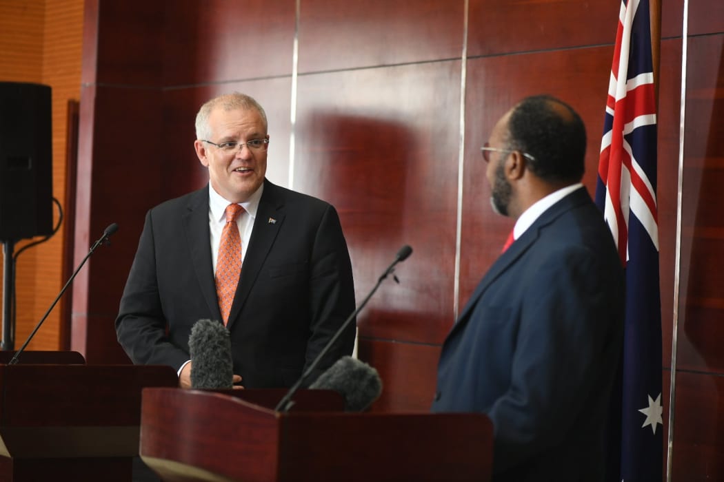Scott Morrison (left) speaks to Charlot Salwai's in Vanuatu.