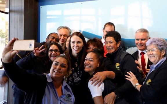 Jacinda Ardern and Tourism Minister Kelvin Davis with Kaikōura Whale Watch team.