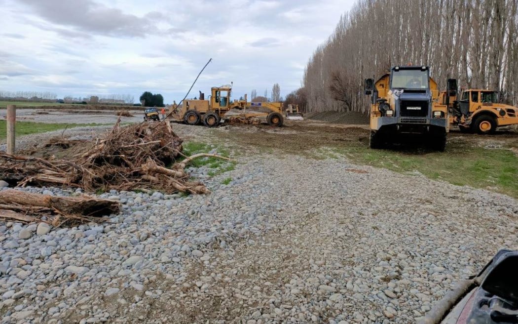 Stacey Stewart's farm after water had receded and diggers removed shingle from the farm.