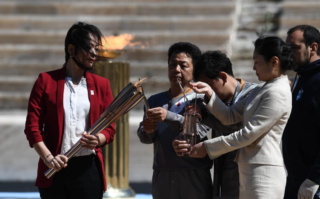 The Olympic Flame is handed over officially to the  congregation from Japan, 2020.