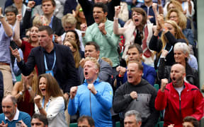 Andy Murray's players' box celebrates after he takes the first set during the 2016 French Open tennis championship.