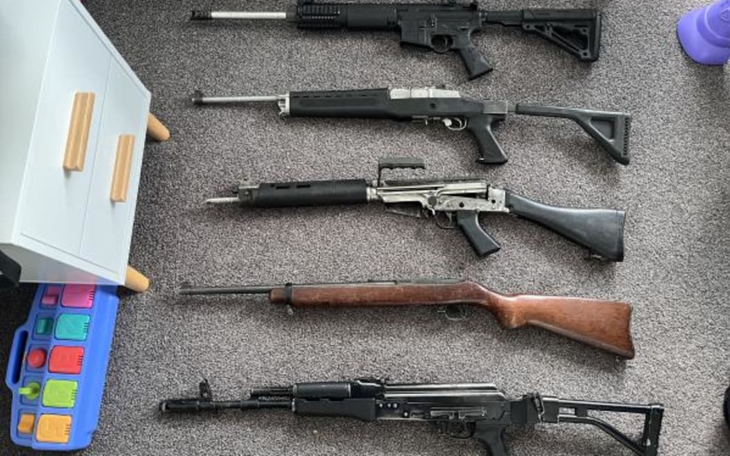 Five military-style firearms were found in children's bedrooms during the search of a house in Napier.