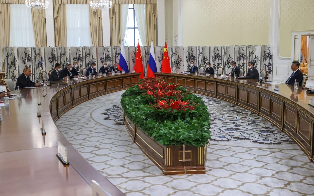 Russian President Vladimir Putin (far left) meets with China's President Xi Jinping (far right) on the sidelines of the Shanghai Cooperation Organisation (SCO) leaders' summit in Samarkand, Uzbekistan on 15 September, 2022.