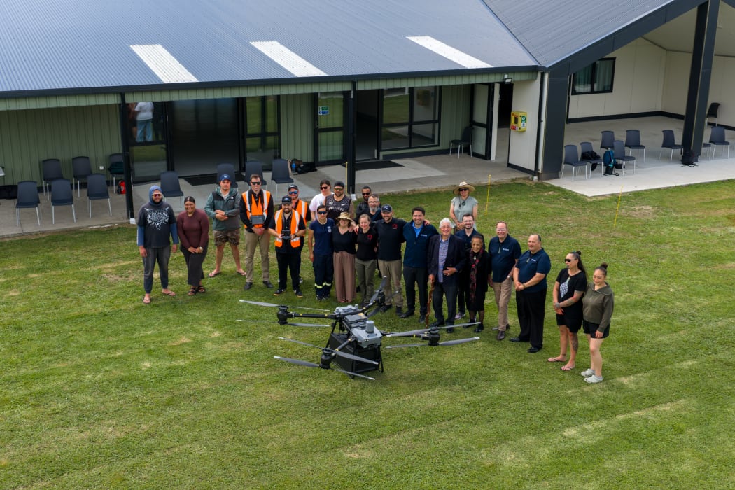 The drone used in the trial and members of the team involved.