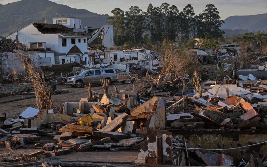 View of a destroyed neighborhood after flooding in Arroio do Meio, Rio Grande do Sul State, Brazil, taken on May 22, 2024. More than 600,000 people have been displaced by the heavy rain, flooding and mudslides that have ravaged the south of the state of Rio Grande do Sul for around two weeks. (Photo by Nelson ALMEIDA / AFP)