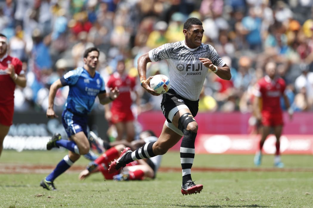 Fiji captain Meli Derenalagi races away from the Wales defence.