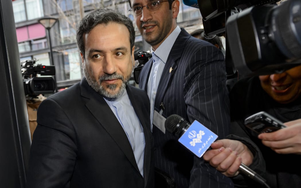 Iranian Deputy Foreign Minister Abbas Araqchi enters the mission of the European Union building on December 17, 2014 in Geneva. World powers resumed negotiations with Iran on December 17 over Tehran's disputed nuclear program more than three weeks after they last met and gave themselves another seven months to strike a deal.    AFP PHOTO / FABRICE COFFRINI (Photo by FABRICE COFFRINI / AFP)