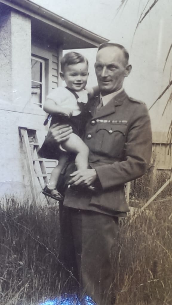 Ray, holding Rod as a baby.