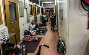 Patients wait along a corridor in the triage area of the National Referral Hospital in Solomon Islands.