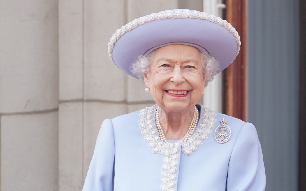 Britain's Queen Elizabeth II stands on the Balcony of Buckingham Palace bas the troops march past during the Queen's Birthday Parade, the Trooping the Colour, as part of Queen Elizabeth II's platinum jubilee celebrations, in London on June 2, 2022