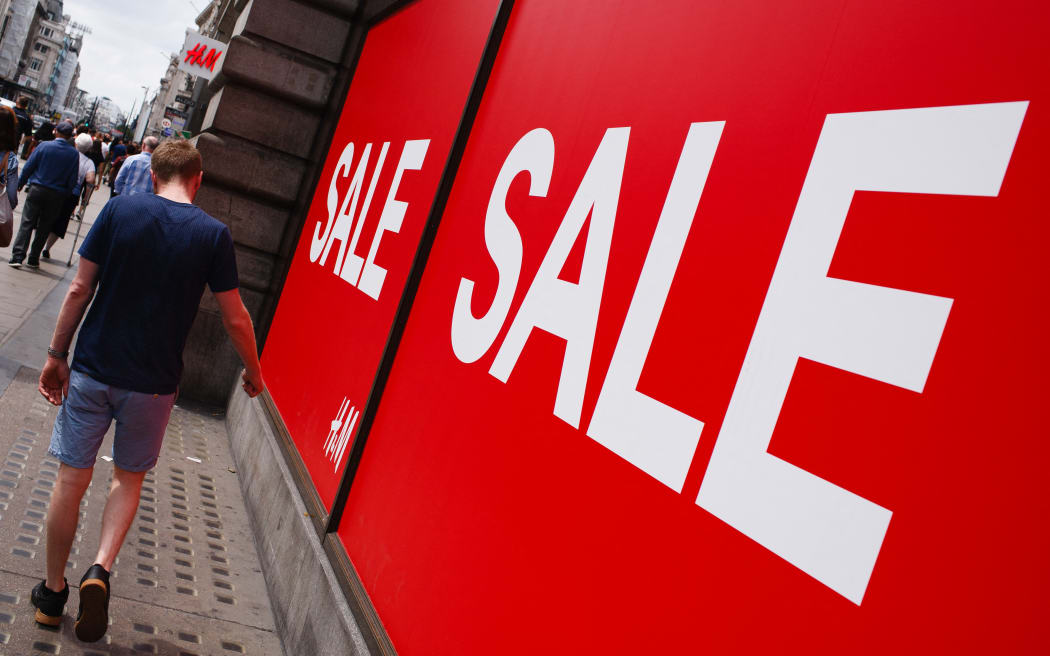 Shoppers walk past sales signs outside a branch of fast fashion retailer H&amp;M on Oxford Street in London, England, on July 13, 2019. New retail sales figures for the UK, covering June 2019, are to be released by the Office for National Statistics on Thursday, July 18. (Photo by David Cliff/NurPhoto) (Photo by David Cliff / NurPhoto / NurPhoto via AFP)