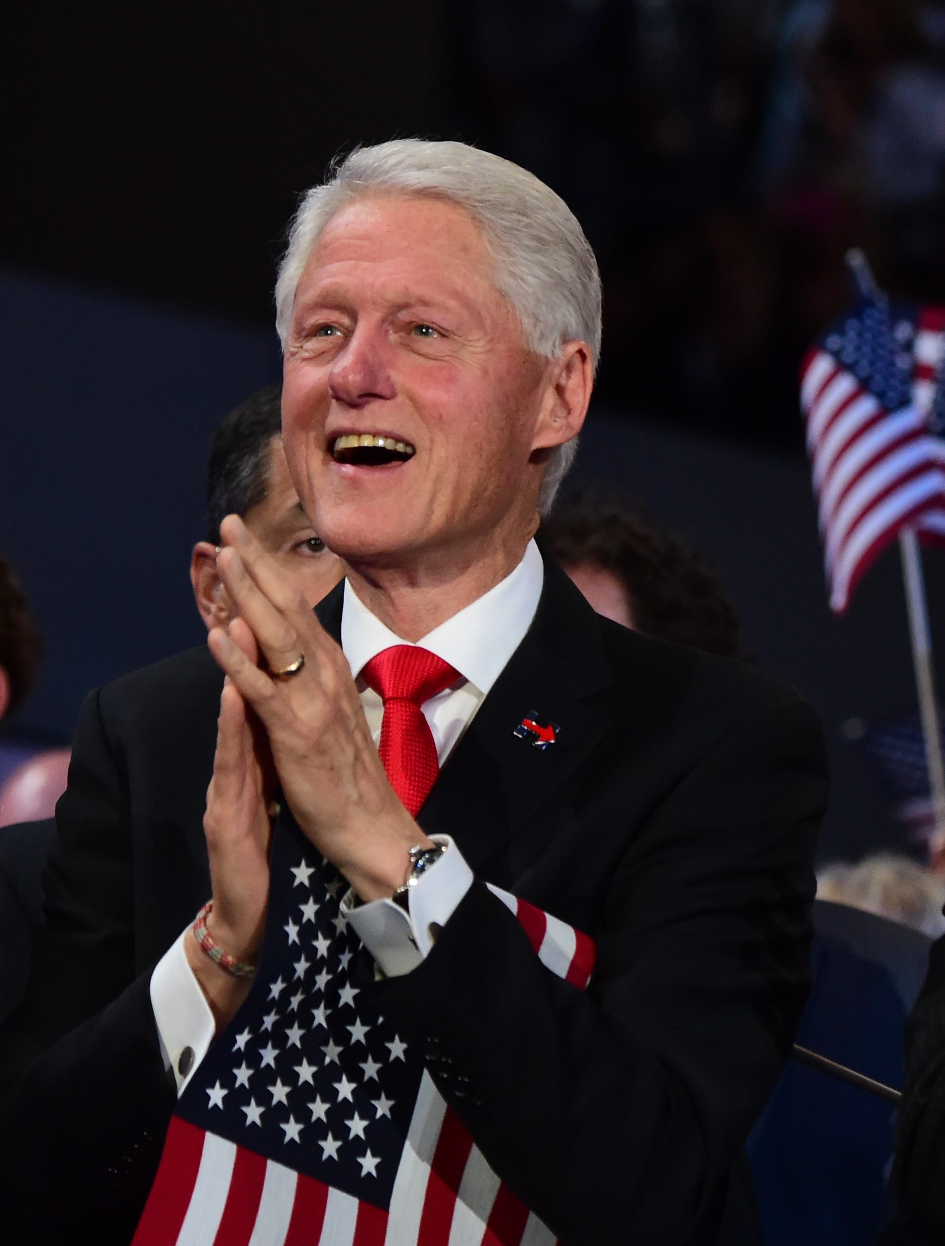 Chelsea Clinton, Bill Clinton and Democratic vice presidential candidate Tim Kaine applaud Mrs Clinton's speech.