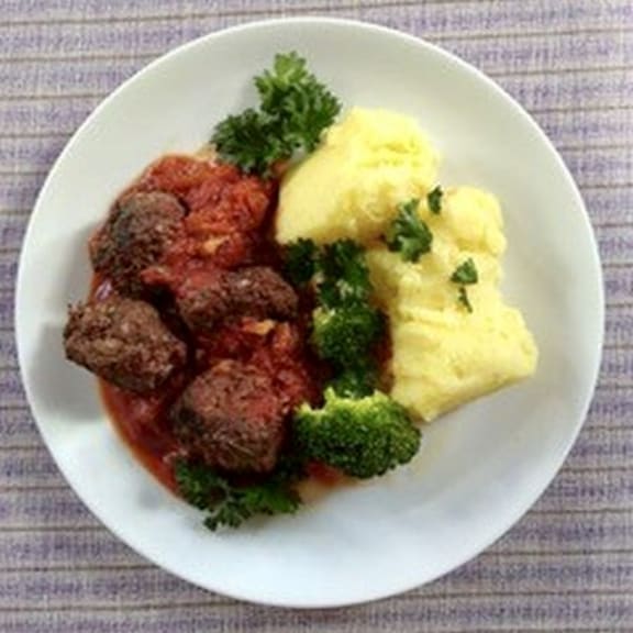 Meatballs in a spicy sauce; one of three suggested uses for this oven-baked tomato sauce.
