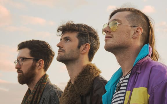 Christchurch live house music band Beacon Bloom standing looking up at the sky in a promotional image.