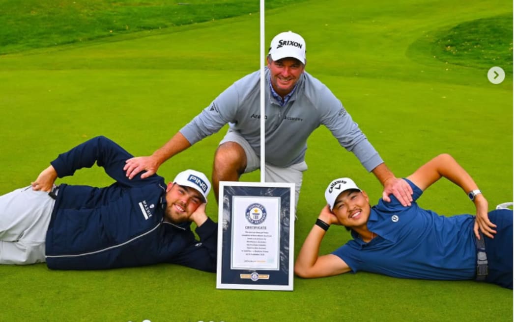 Dan Bradbury (left), Ryan Fox (middle), and Min Woo Lee, pose with the Guinness World Record certificate.