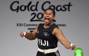 Eileen Cikamatana celebrates on her way to winning gold in the women's 90kg weightlifting final at the 2018 Gold Coast Commonwealth Games.