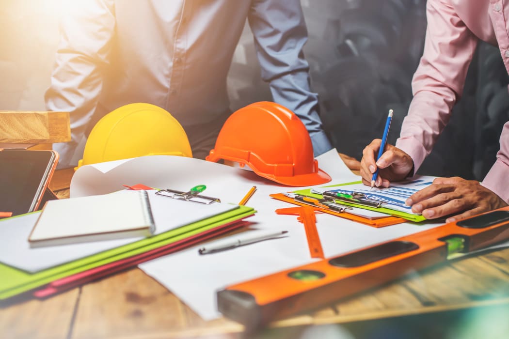 Structural engineer teamwork discussing hardworking in the office on building structure concept of worldwide building project.