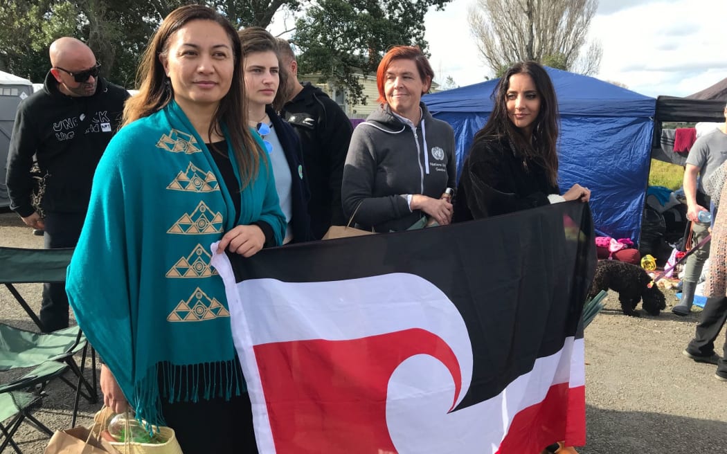 Green Party MPs Marama Davidson, Chloe Swarbrick and Golriz Ghahraman at Ihumātao on 26 July.