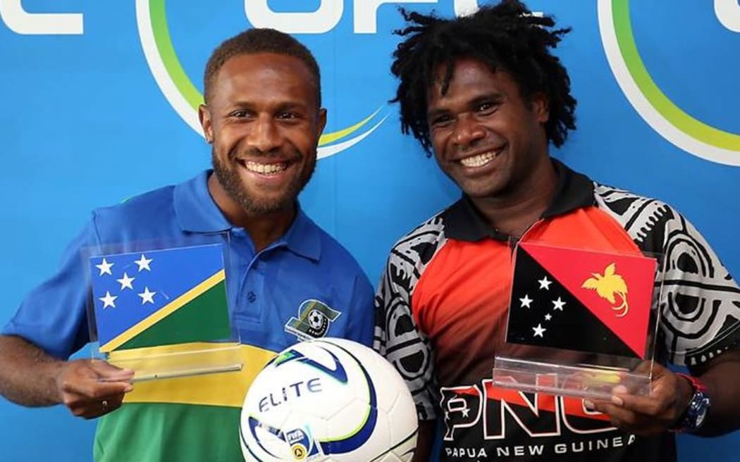 Solomon's Henry Fa'arodo and PNG's David Muta.