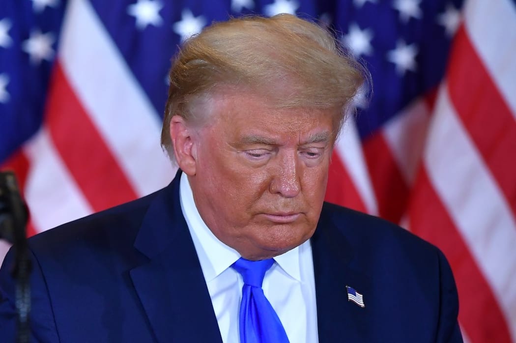 US President Donald Trump looks on after speaking during election night in the East Room of the White House in Washington, DC, early on November 4, 2020.