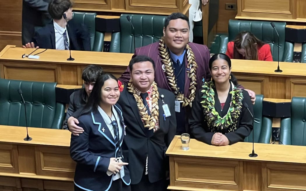 Pasifika Youth MP's in the debating chambers including Marques Tominiko in the middle.
