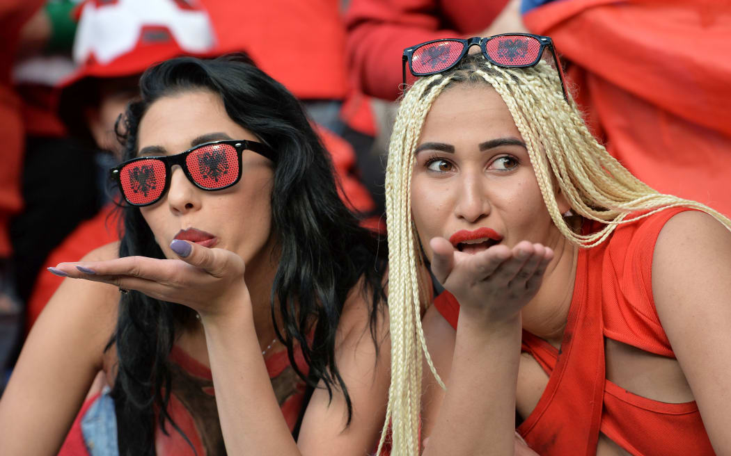 Fans watch the match between Albania and Romania.