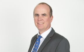 A portrait of immigration lawyer Alastair McClymont.