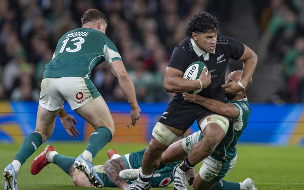 All Black Wallace Sititi is tackled by Jamison Gibson-Park of Ireland during All Blacks v Ireland.