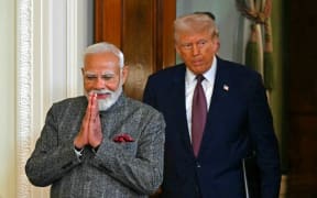 US President Donald Trump and Indian Prime Minister Narendra Modi arrive to hold a joint press conference in the East Room of the White House in Washington, DC, on 13 February, 2025.