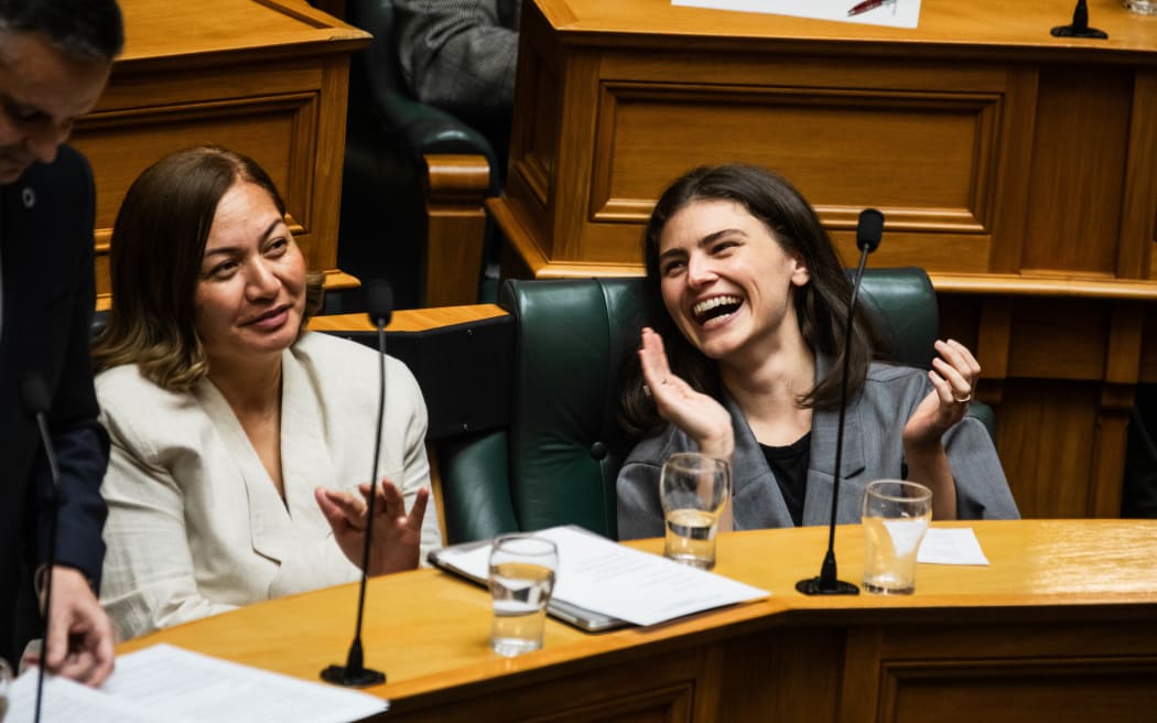 Marama Davidson and Chloe Swarbrick during James Shaw's valedictory speech