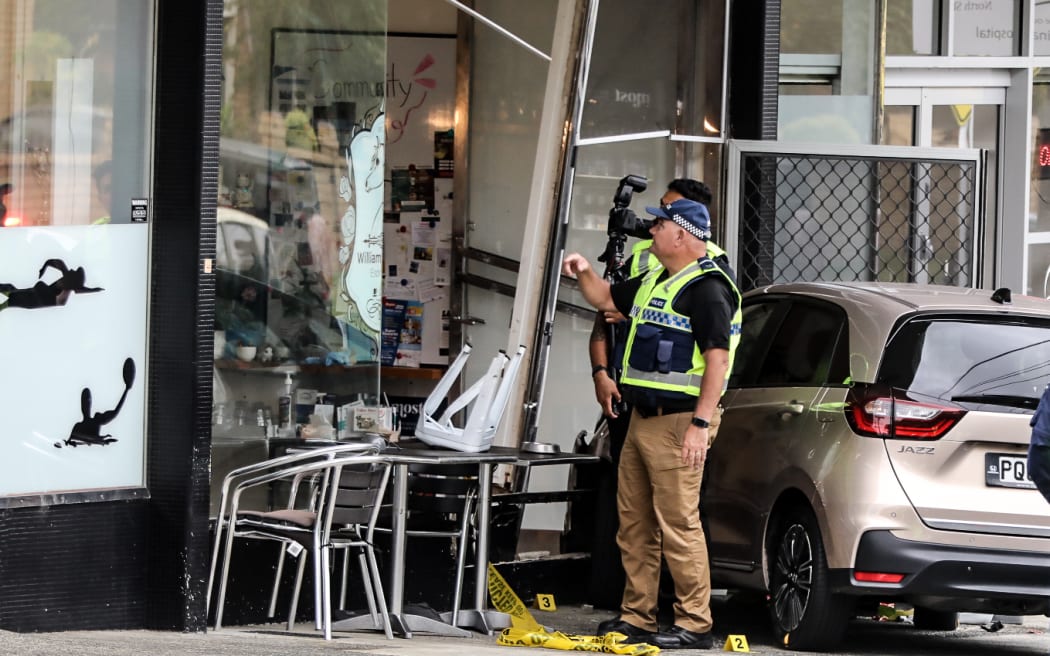 A woman at an Auckland cafe has been left bleeding and with life-threatening injuries after a car crashed into the building in Auckland.