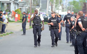 BUFFALO, NY - MAY 14: Buffalo Police on scene at a Tops Friendly Market on May 14, 2022 in Buffalo, New York. According to reports, at least 10 people were killed after a mass shooting at the store with the shooter in police custody.   John Normile/Getty Images/AFP (Photo by John Normile / GETTY IMAGES NORTH AMERICA / Getty Images via AFP)