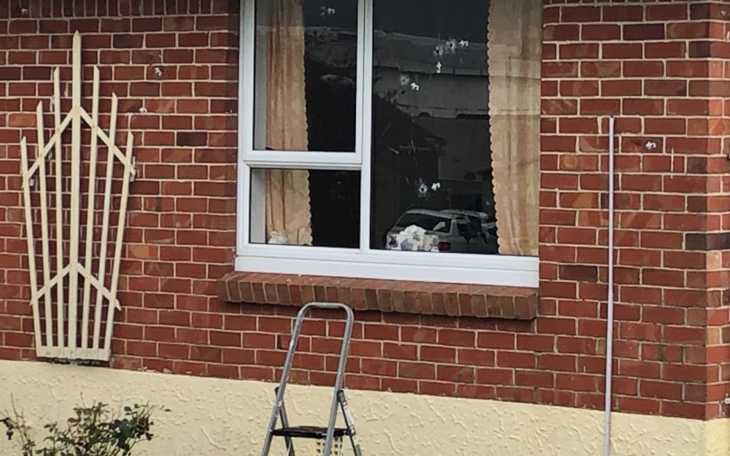 Five bullets were fired through the bedroom window.