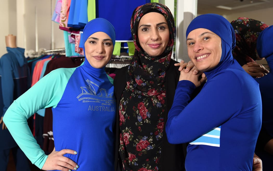 Muslim models display burkini swimsuits at a shop in western Sydney